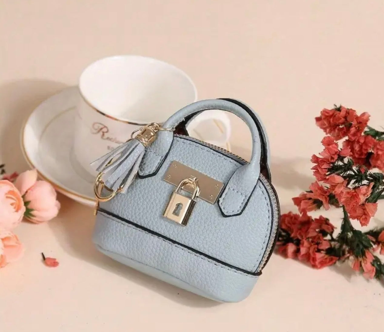Mini Purse (Loaded with Essentials) + Mini perfume randomly chosen.