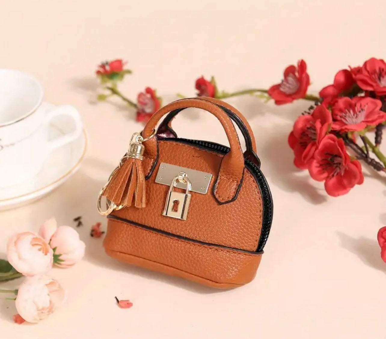 Mini Purse (Loaded with Essentials) + Mini perfume randomly chosen.