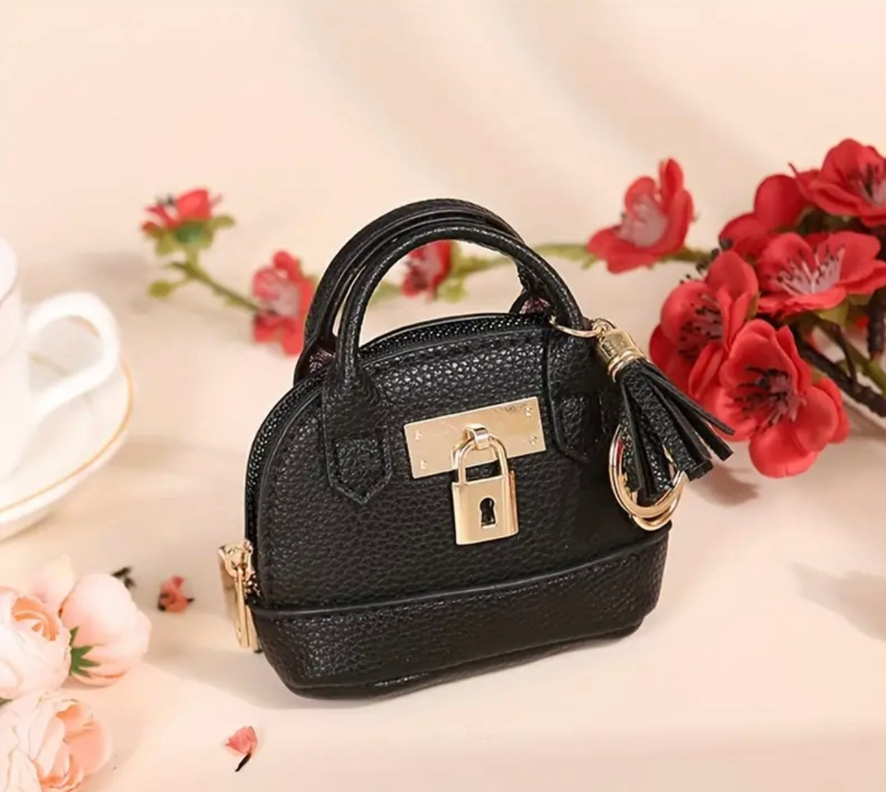 Mini Purse (Loaded with Essentials) + Mini perfume randomly chosen.