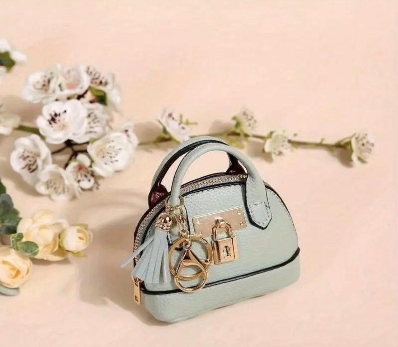 Mini Purse (Loaded with Essentials) + Mini perfume randomly chosen.