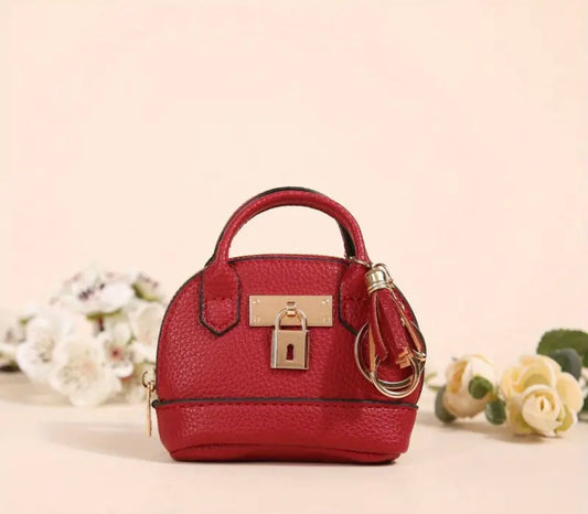 Mini Purse (Loaded with Essentials) + Mini perfume randomly chosen.