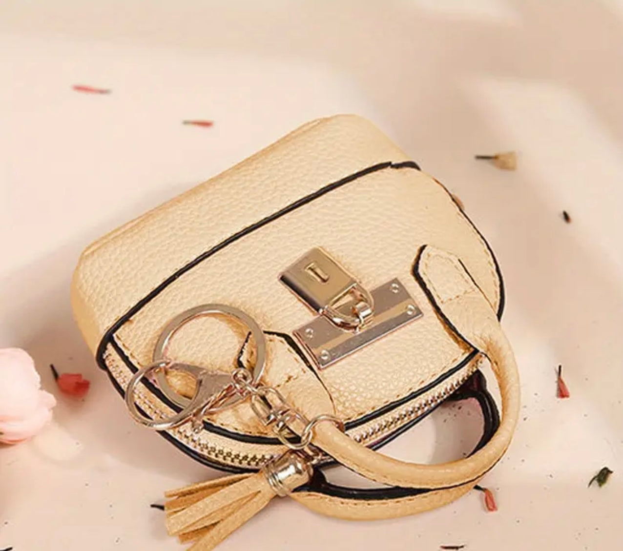 Mini Purse (Loaded with Essentials) + Mini perfume randomly chosen.
