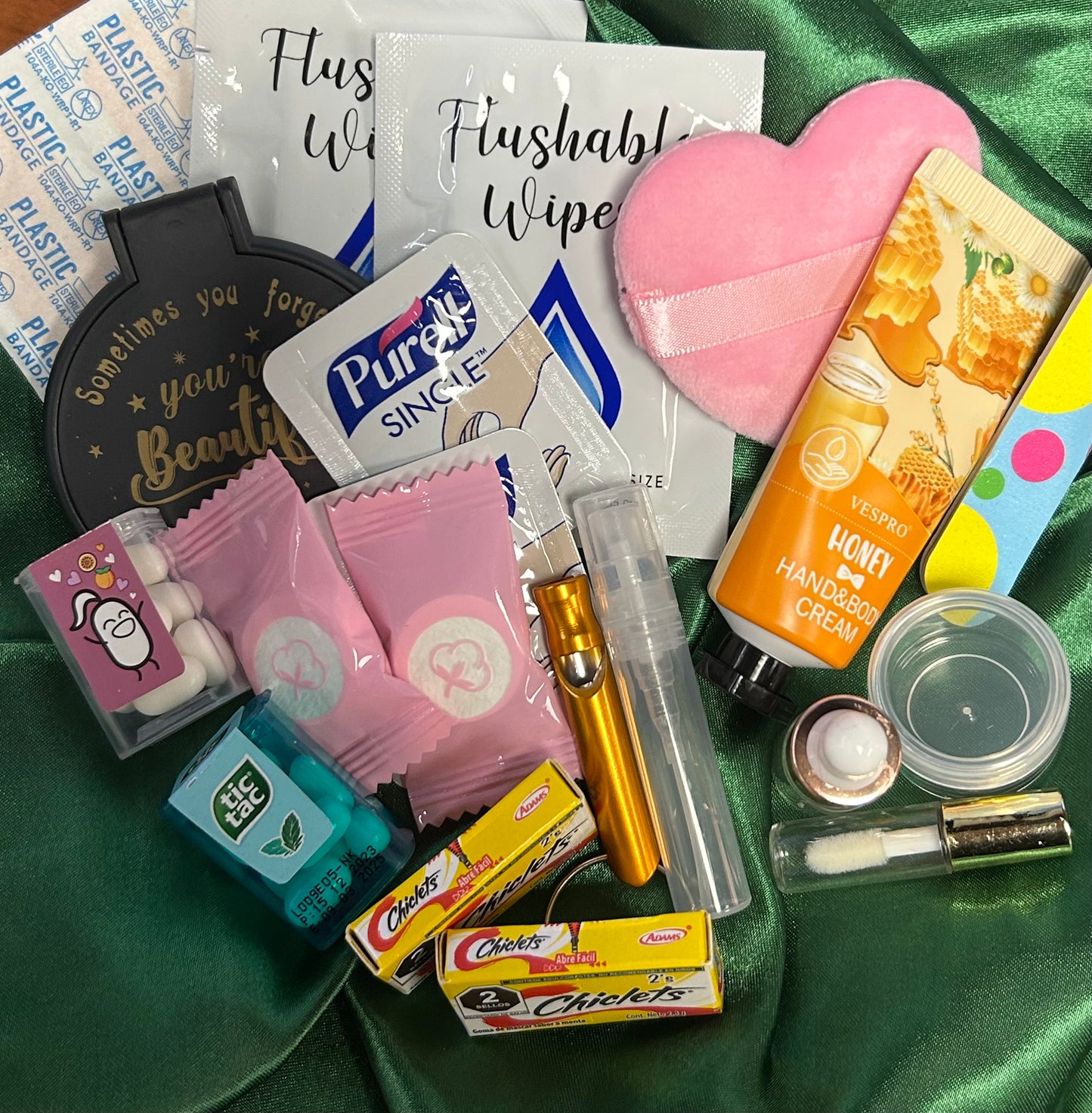 Mini Purse (Loaded with Essentials) + Mini perfume randomly chosen.